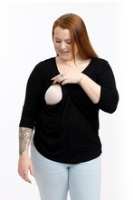 Load image into Gallery viewer, A 3/4 sleeve breastfeeding top in black that you can wear pregnant. Does not look like a maternity top
