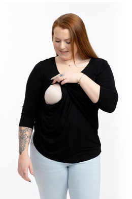 A 3/4 sleeve breastfeeding top in black that you can wear pregnant. Does not look like a maternity top