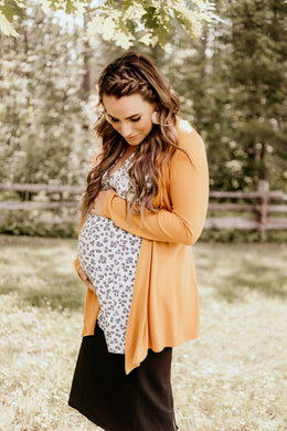 Mustard orange open maternity cardigan. Pregnancy clothes for your baby bump.
