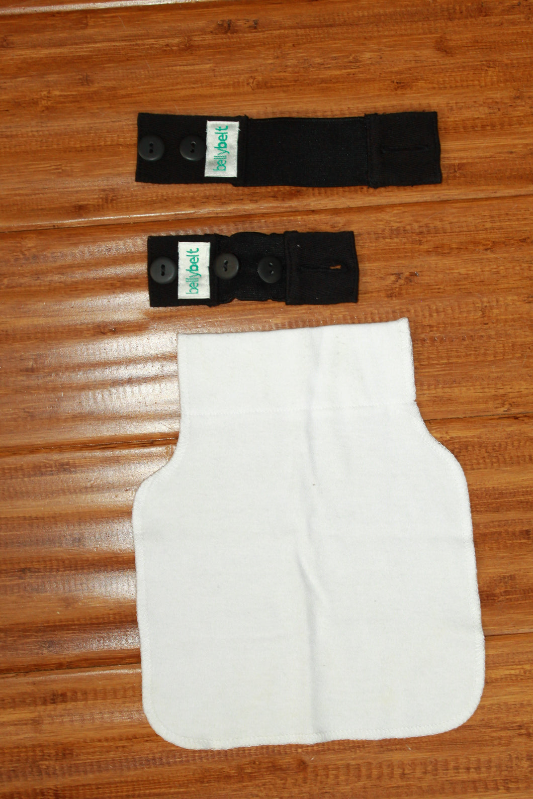 Belly belt panel to keep wearing your pre pregnancy pants. Belly band. First trimester.